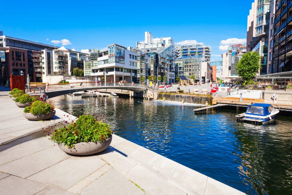 Modern waterfront with bridge and moored boat