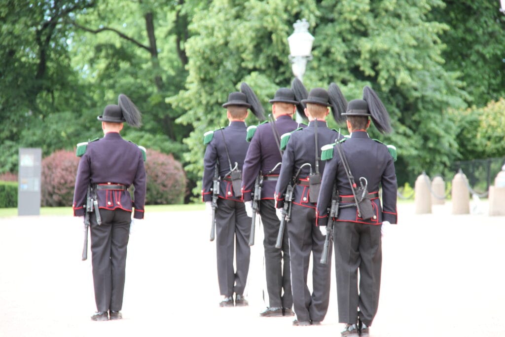 Ceremonial guards marching in formation outdoors