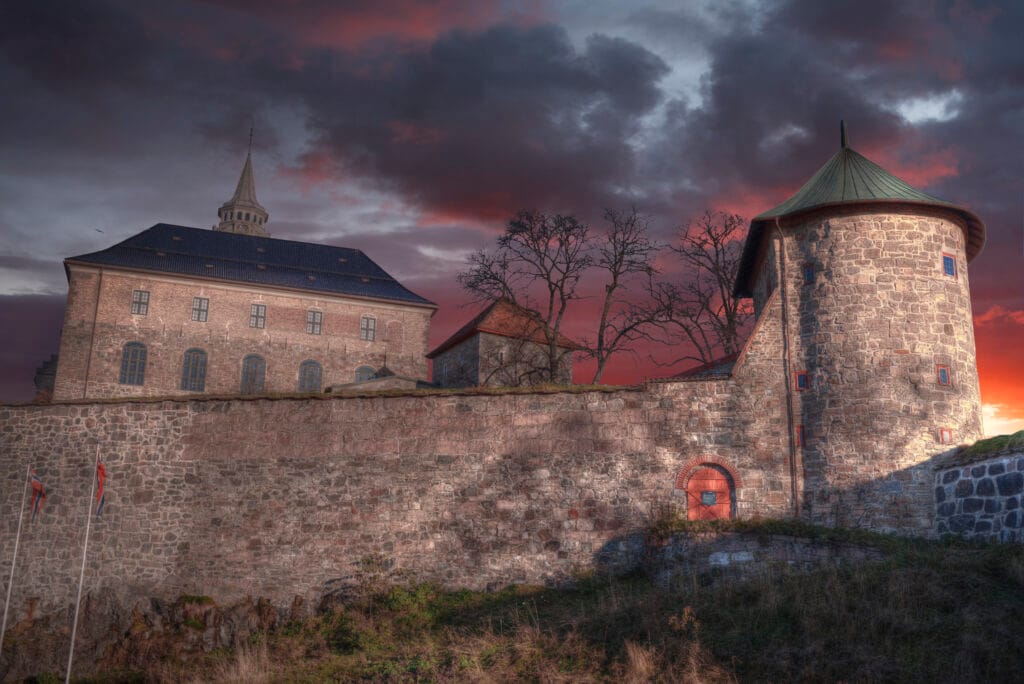 Historic stone fortress at dramatic sunset