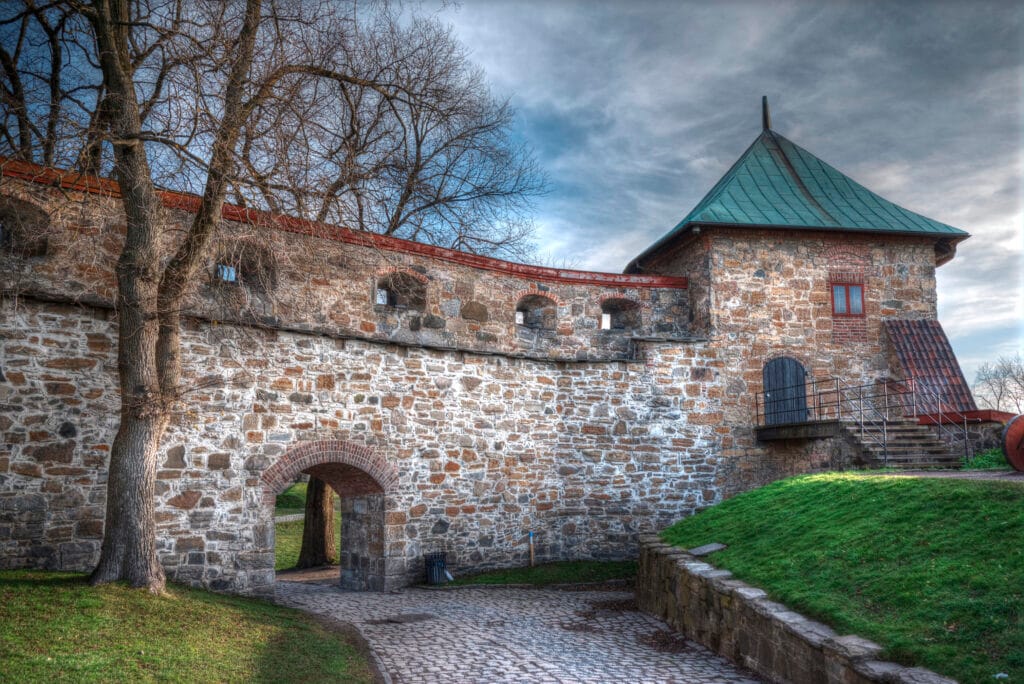 Historic stone fortress wall with arched gateway