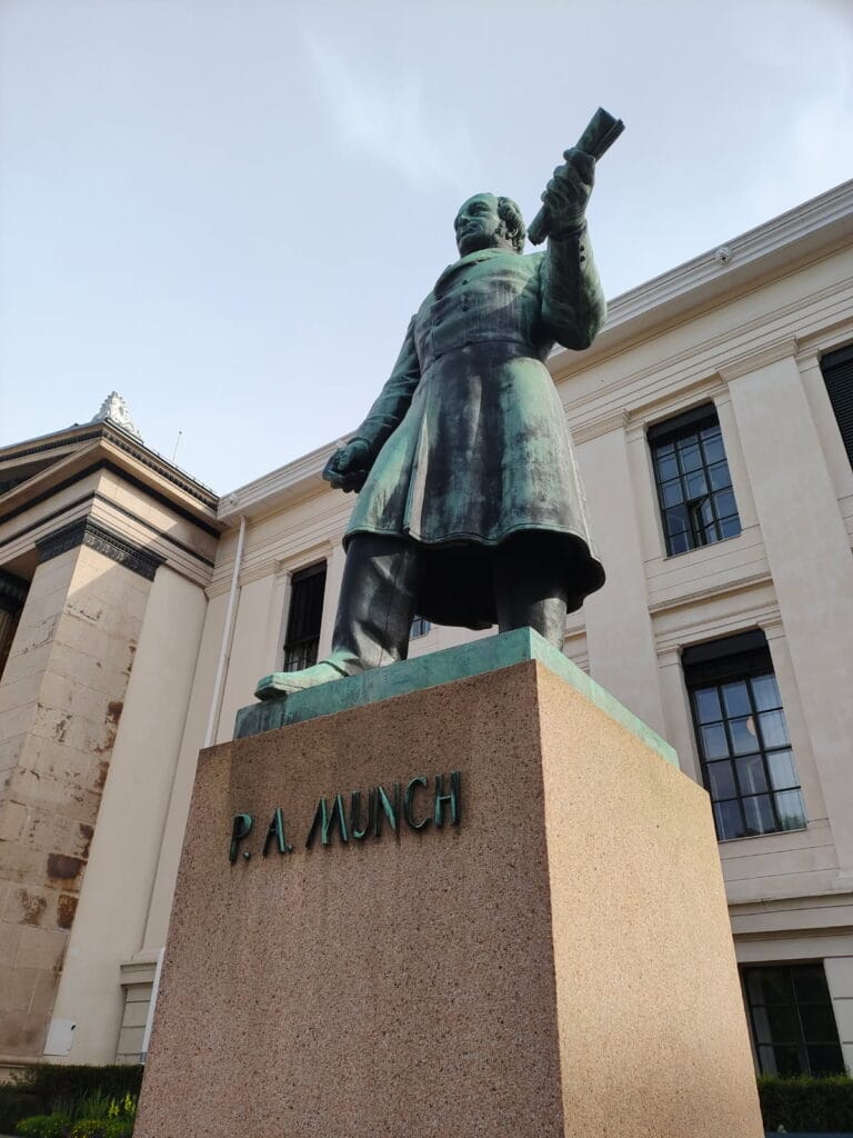 Statue of P.A. Munch outside historic building