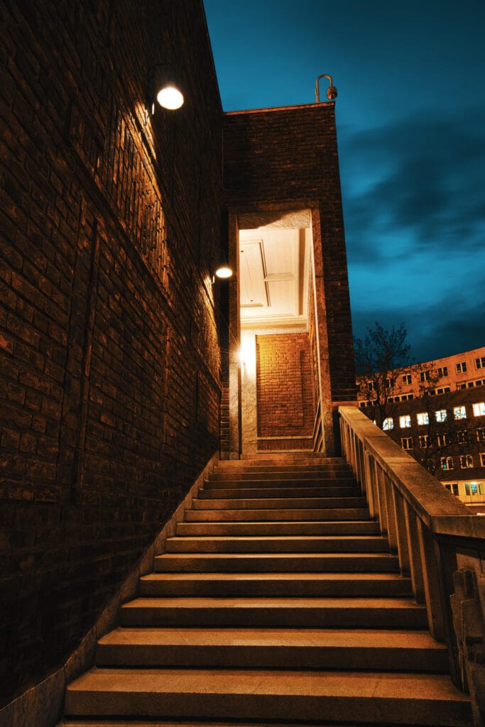 Illuminated brick stairway at dusk